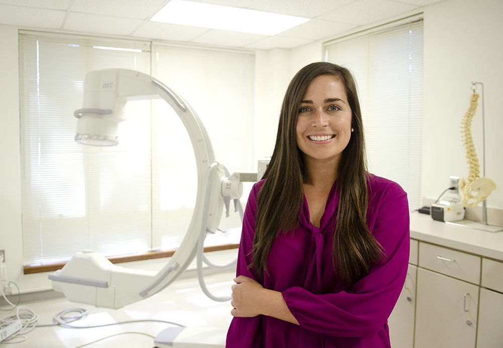 Lauren Sylvester with an imaging machine